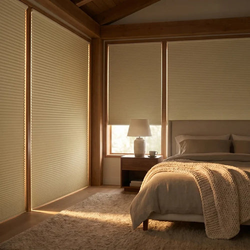 A look at Creamy White 1 2 Inch Budget Single Cell Blackout Cordless Shades inside a modern bedroom, blocking out exterior light to create a peaceful atmosphere.