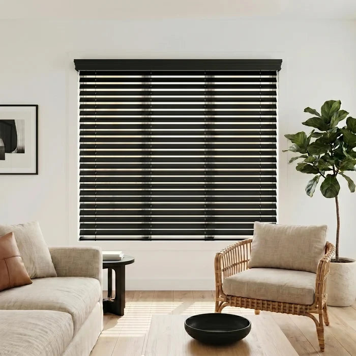 Immerse yourself in a serene atmosphere with the Hardwood Cordless Horizontal Blinds' sleek Deep Black slats, perfectly complementing the white window and beige and brown couches.