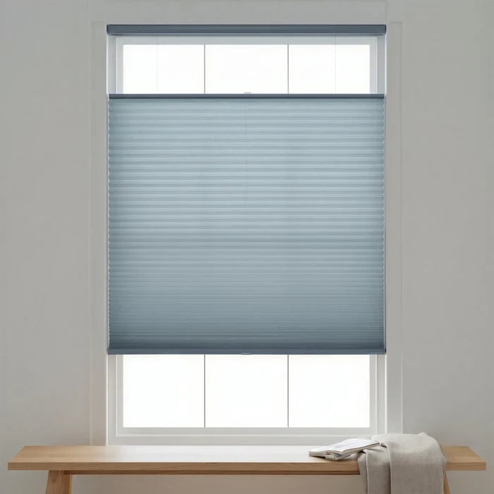 Elegant Light Blue (Hazy) 3 8 Budget Single Cell Light Filtering Top Downbottom Up Shades complementing a modern reading nook, bathing the space in soft light with dynamic window coverage.