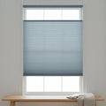 Elegant Light Blue (Hazy) 3 8 Budget Single Cell Light Filtering Top Downbottom Up Shades complementing a modern reading nook, bathing the space in soft light with dynamic window coverage.