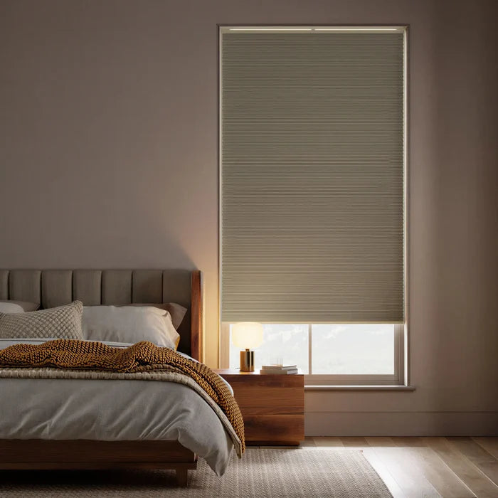 Custom window treatments: Light Brown 9 16 Inch Classic Single Cell Blackout Cordless Shades shown in a modern bedroom, perfect for dimming the room completely.
