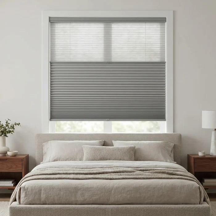 Grey 9 16 Classic Single Cell Daynight Cordless Shades installed in a peaceful bedroom, enhancing the window's aesthetic seamlessly.