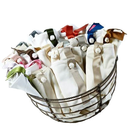 Colorways of Charmeuse Bands for Sheet Set displayed in wire basket