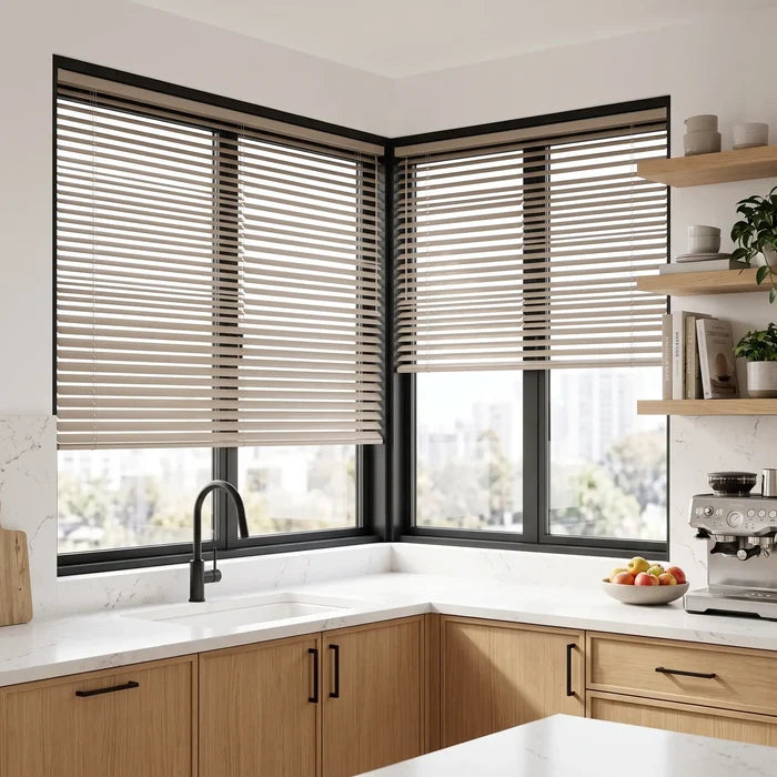 Beige Classic Cordless 6g Aluminum Mini Blinds installed in a cozy kitchen, offering a sleek, moisture-resistant window treatment.