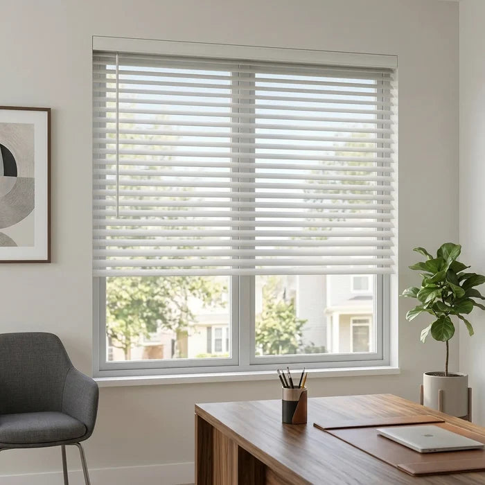 A cozy living room featuring White (Yellow White) Classic Cordless 8g Aluminum Mini Blinds, offering a sleek, moisture-resistant window treatment.