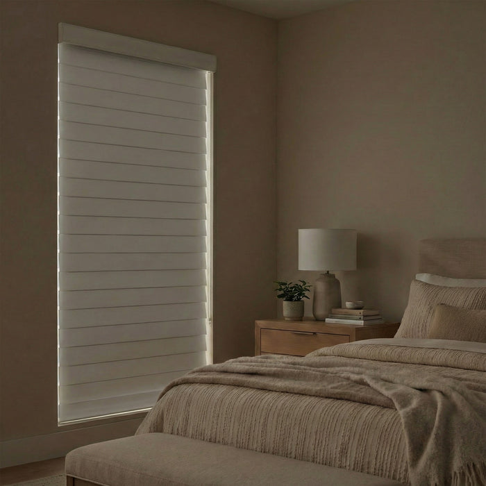 Closed Light diffusing sheer shades elegantly blocking light in a clean natural toned bedroom.