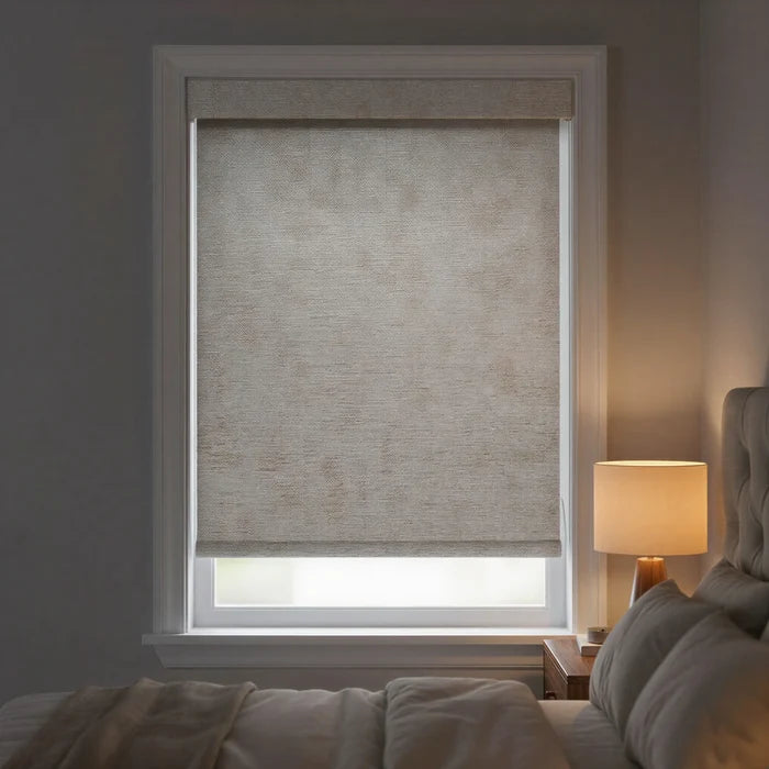 Main view of light gray Jerusalem Silver Luxe natural room darkening roller shades in a modern bedroom with neutral tones.