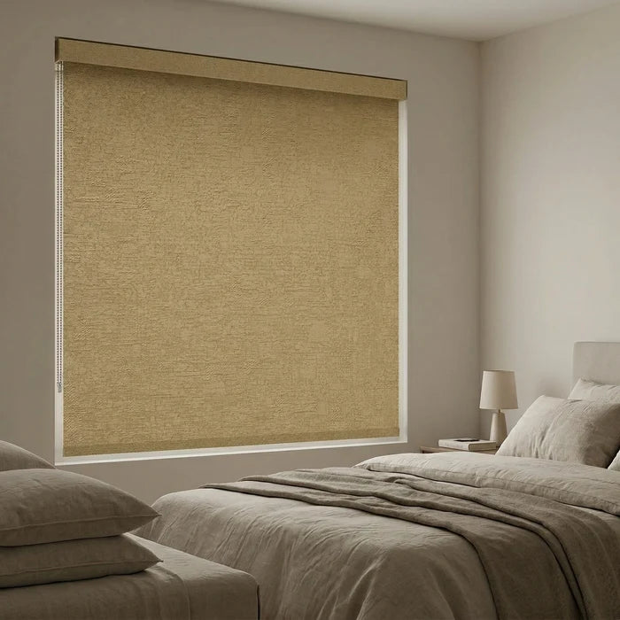 Inside mount Jerusalem Gold Luxe room darkening roller shades in a warm bedroom, showcasing a clean and integrated look.