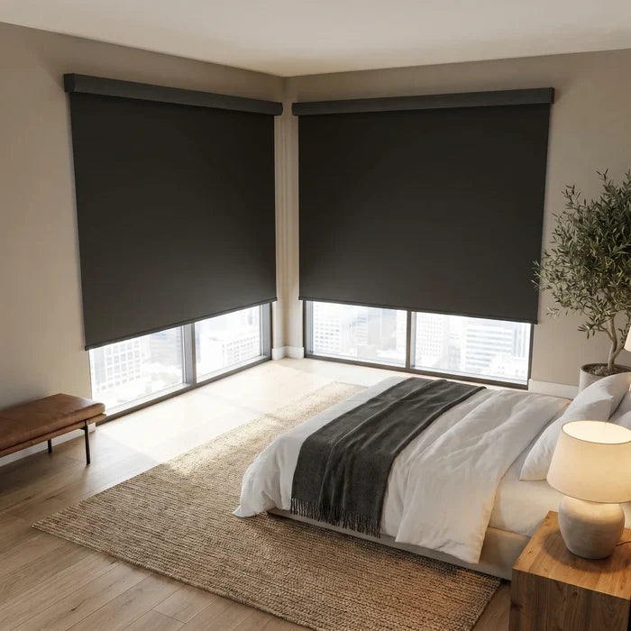 Modern Fabric Blackout Roller Shades bring elegance and light control to this serene bedroom retreat with charcoal accents