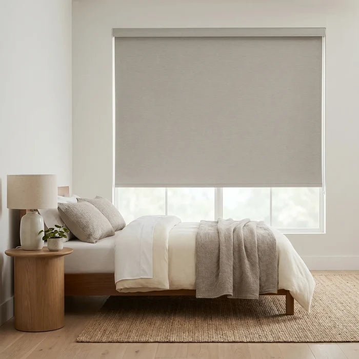 Modern Fabric Blackout Roller Shades in gray create a serene ambiance, blocking light and ensuring privacy for relaxation.