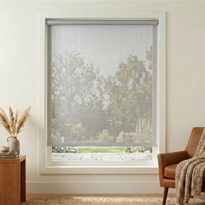 Enhance your Premier 5% Solar Screen Roller Shade experience with creamy white shades that filter out UV rays and block harsh sunlight, perfect for cozy living rooms.