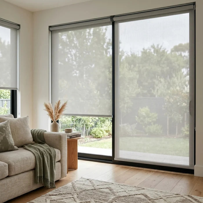 Premier 5% Solar Screen Roller Shade filters sunlight while maintaining a creamy white ambiance, perfect for relaxing moments.