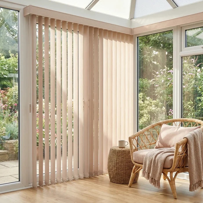 White Premier Pvc Vertical Blinds providing a structured touch to this serene living space, perfect for covering sliding glass doors or large windows.