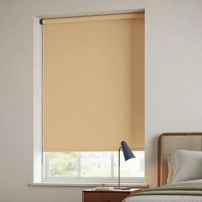 Tan Navajo-colored signature blackout roller shades installed in a contemporary bedroom for sleep optimization.