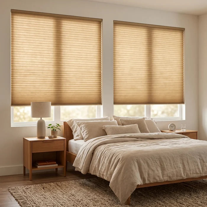 Simplistic Cordless Pleated Shades in Terra Brown filter gentle sunlight, harmonizing with a serene garden view and calming beige decor in this peaceful bedroom sanctuary.