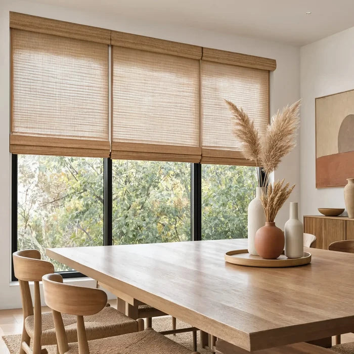 Enhance your modern dining area with Wicker Look Woven Cordless Shades, beautifully complementing warm brown tones and crisp white walls for a harmonious ambiance.