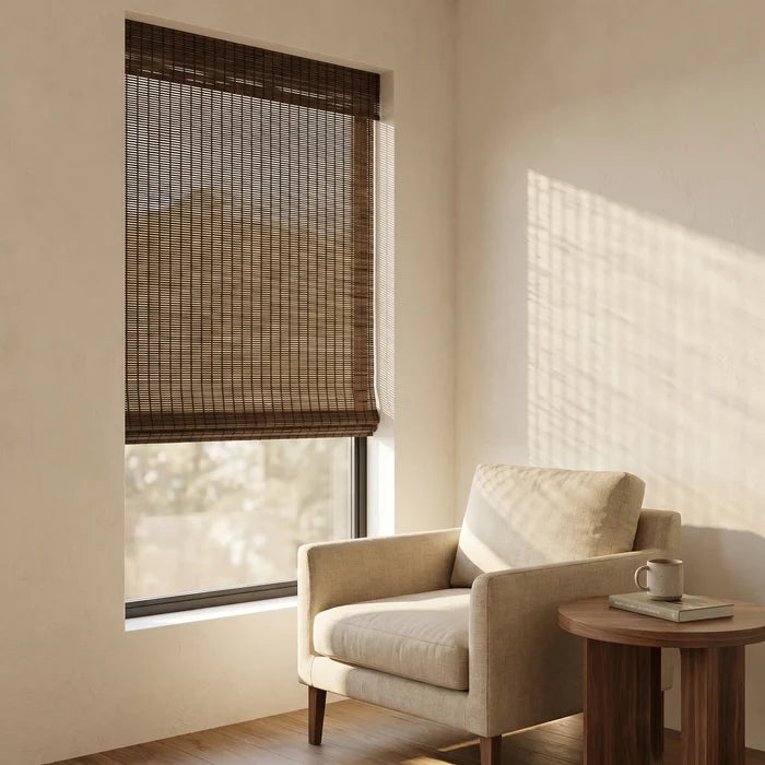Enhance your space with Woven Wood Cordless Shades, effortlessly adjusting privacy and lighting in this serene brown-toned room.