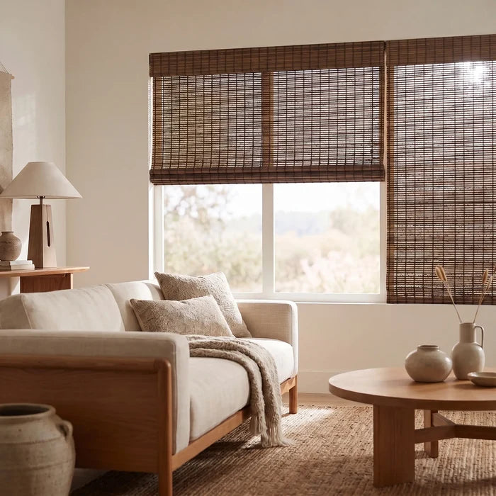 Woven Wood Cordless Top Down Bottom Up Shades bring warmth and versatility to this inviting space, perfectly capturing natural light through brown bamboo blinds.