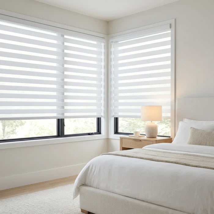 Elevate your bedroom's ambiance with Zebra Room Darkening Roller Shades in creamy white, perfect for a serene retreat from the world.