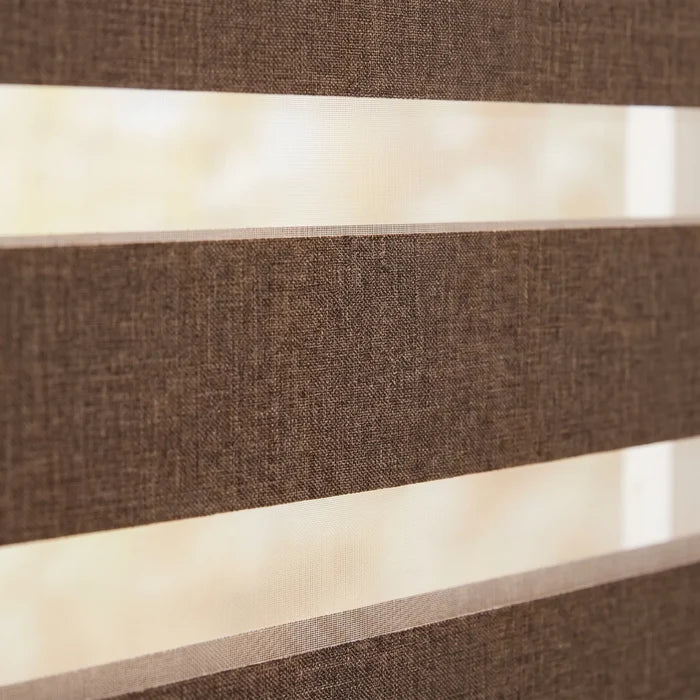 Transform your space with Zebra Room Darkening Roller Shades' earthy brown stripes, perfect for traditional or vintage settings.