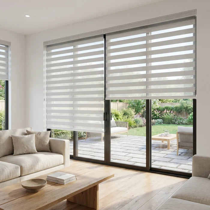 Zebra Solar Roller Shades in Creamy White enhance natural light while providing UV protection and stylish ambiance for this cozy living room.