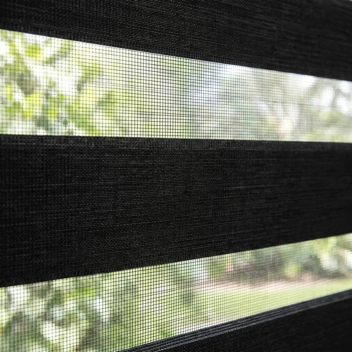 Enhance modern spaces with Zebra Solar Roller Shades, filtering in charcoal-toned light while maintaining privacy and UV protection.